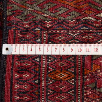 An oriental rug, c. 184 (+4cm flat weave on each end) x 133 cm.