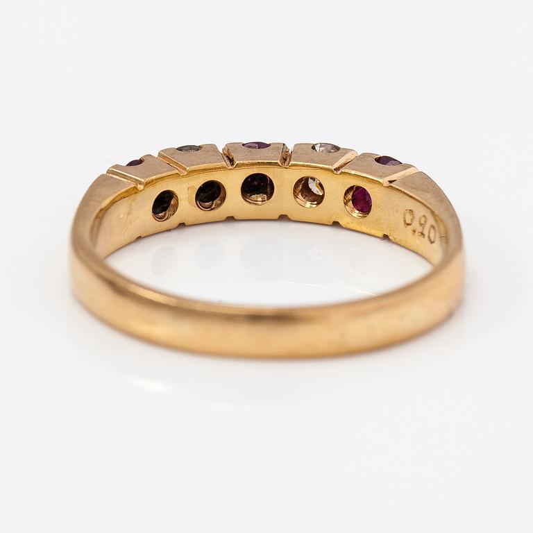 An 18K gold ring with rubies and diamonds ca. 0.20 ct in total. Pentti Toikkanen, Jyväskylä 1988.