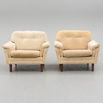 A pair of last quarter of the 20th century Dux easy chairs.