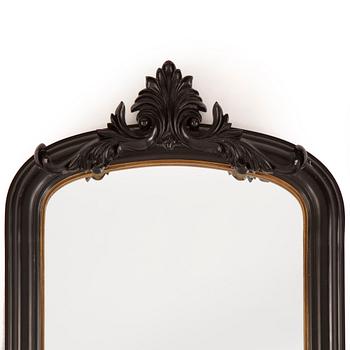 A contemporary floor mirror.