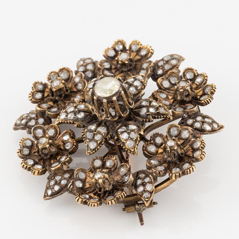 A brooch flower with rose-cut diamonds.