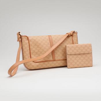 CÉLINE, a beige monogram canvas shoulderbag and wallet.