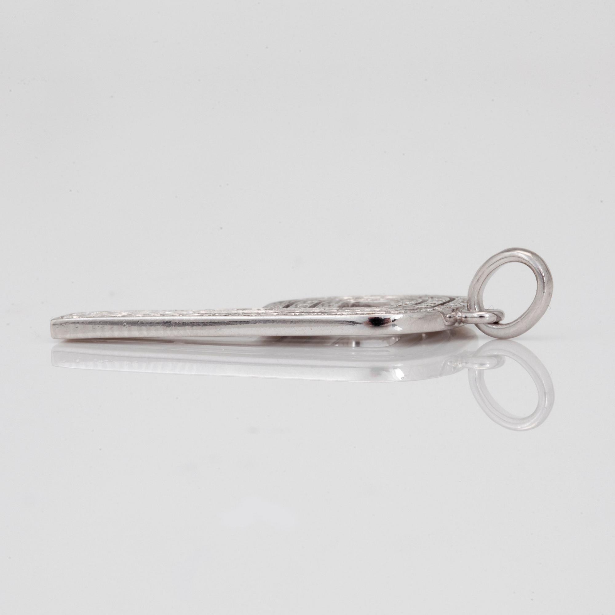 A Garrard and Co brilliant cut diamond pendant. Design by Jade Jagger. "The PI collection".