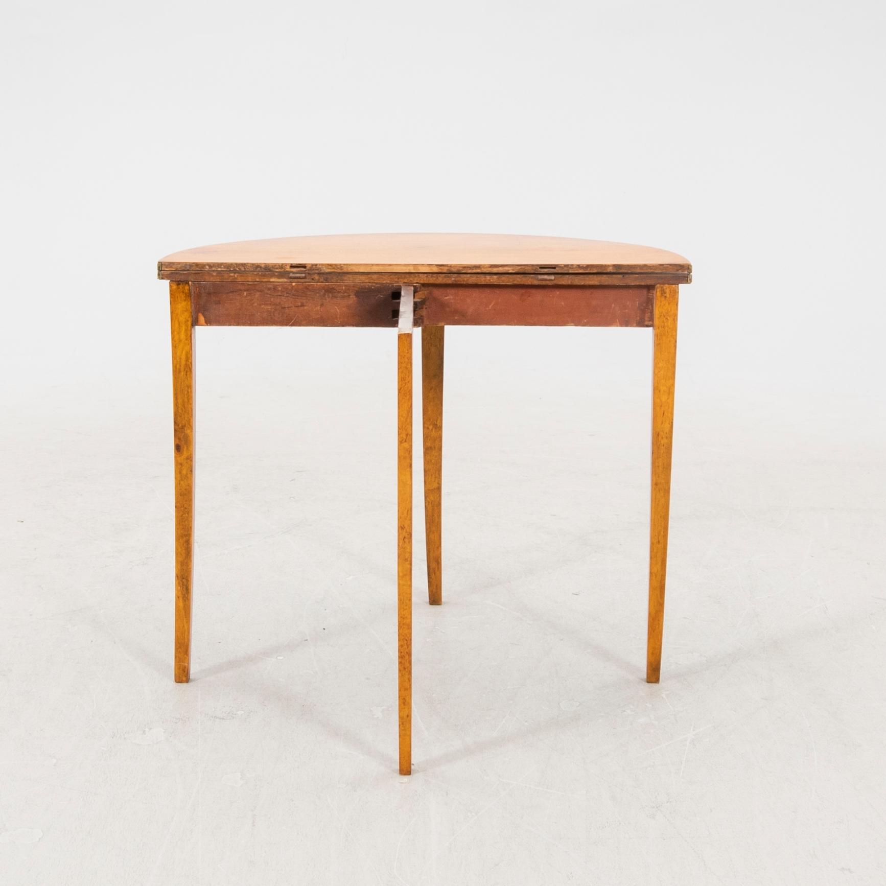 A birch folding table later part of the 19th century.