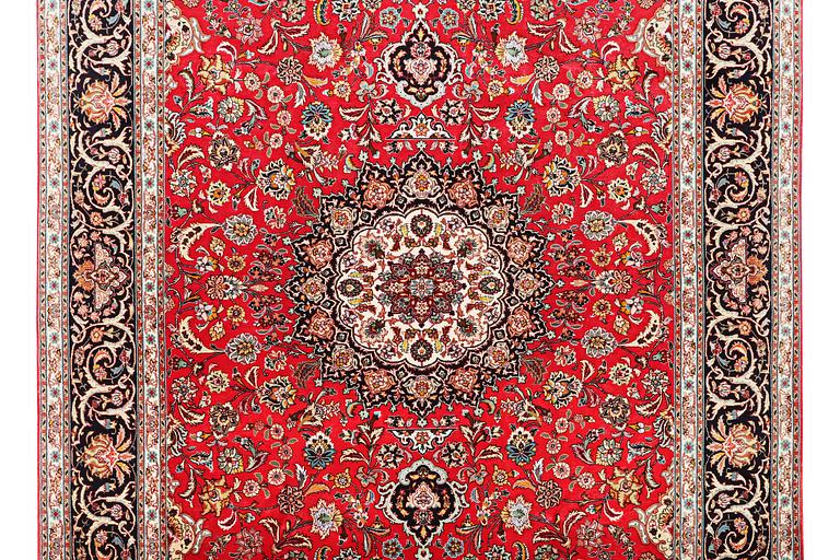 A carpet, Tabriz, part silk, 50 raj, c. 325 x 208 cm.