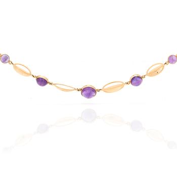 A necklace with round, cabochon-cut amethysts.