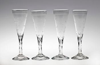 84. A set of four 19th century champagne glasses.