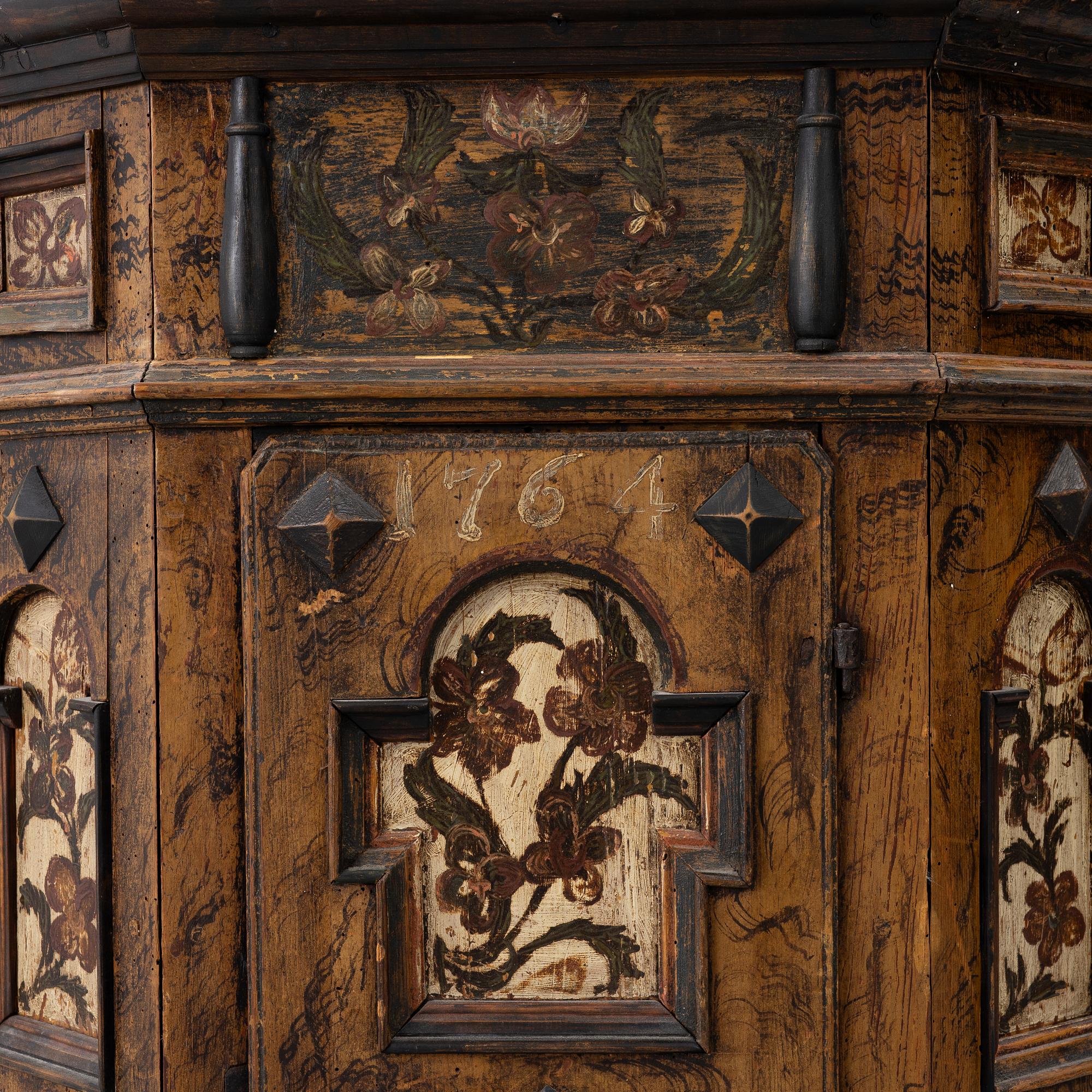 A corner cabinet, 18th Century.