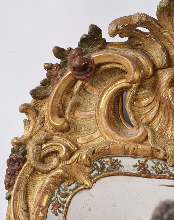 A Swedish giltwood and polychrome-painted Rococo mirror, later part of the 18th century.