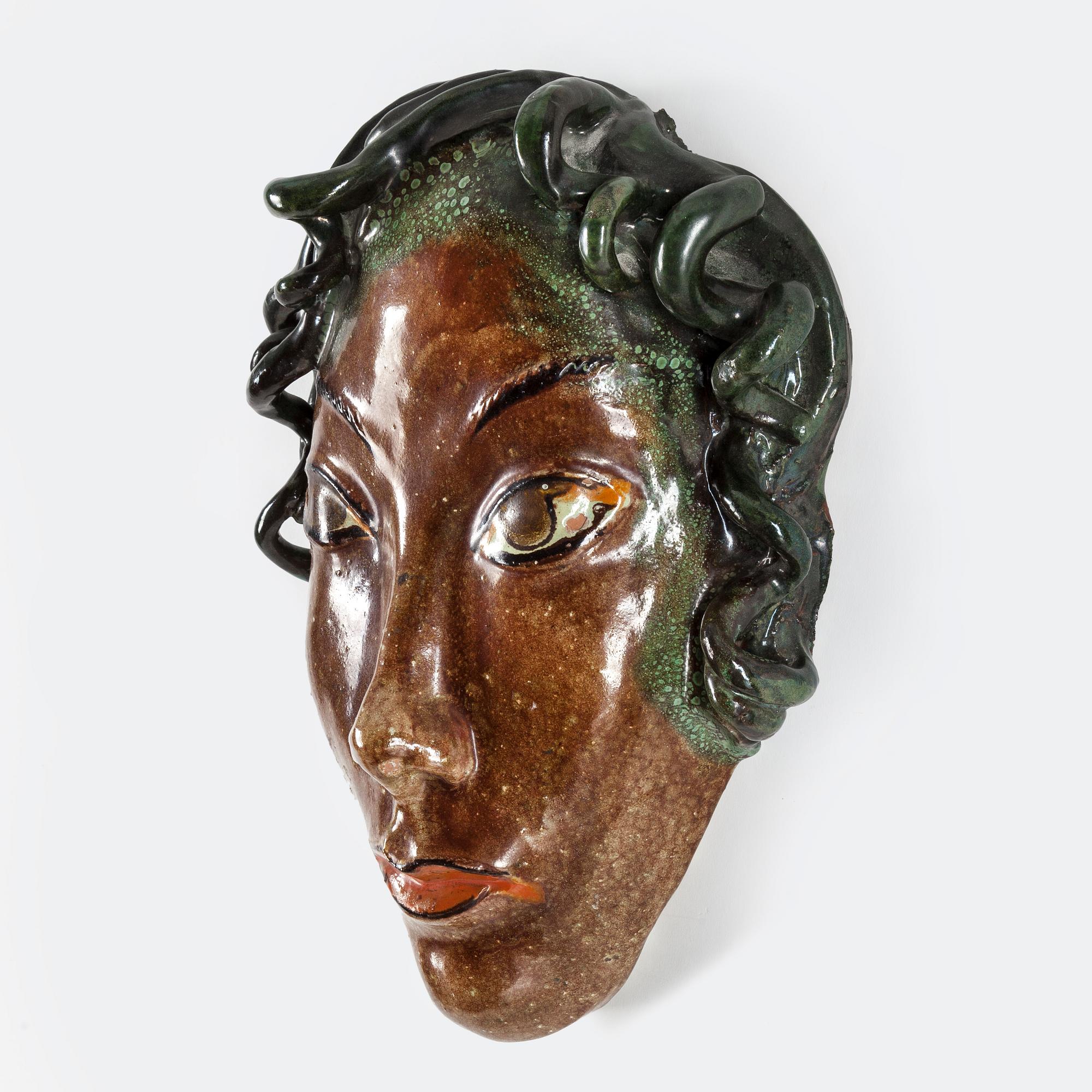 ALLAN EBELING, an earthenware decorative mask from Torshälla, signed.