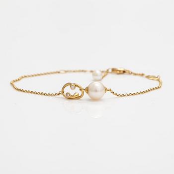 Georg Jensen, An 18K gold bracelet "Magic" with a cultured pearl and diamonds ca. 0.048 ct in total, Denmark.