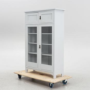A display cabinet, early 20th Century.