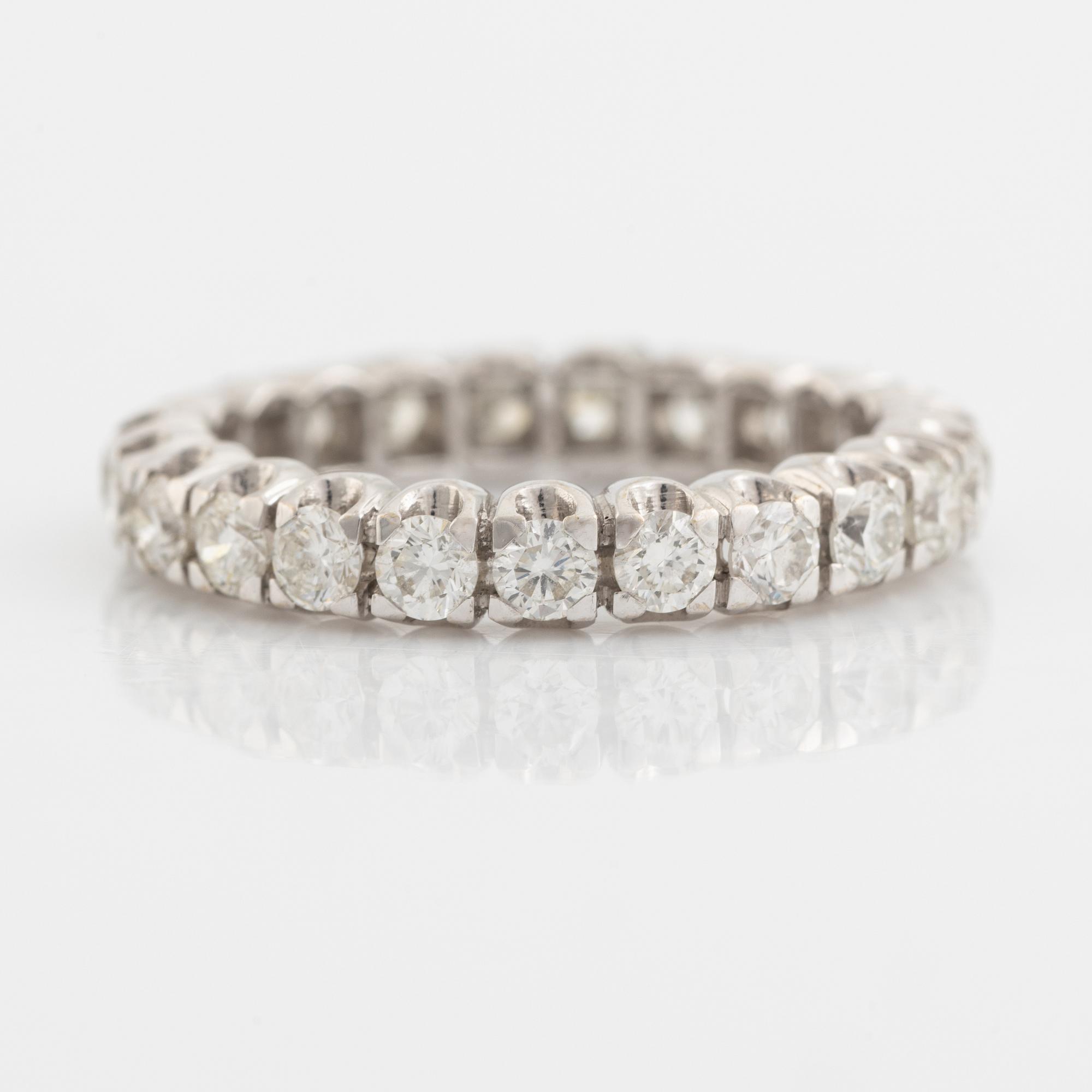 Brilliant cut diamond eternity ring.