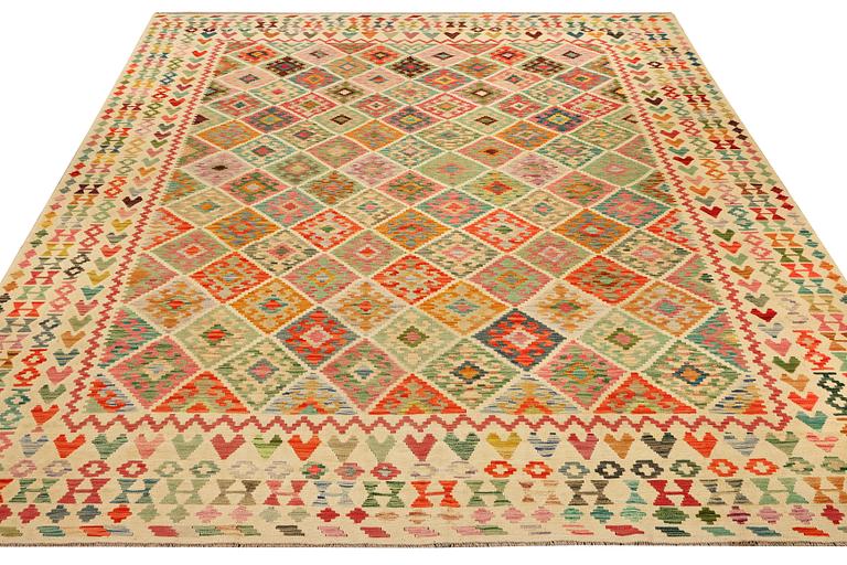 A Kilim carpet, c. 390 x 306 cm.