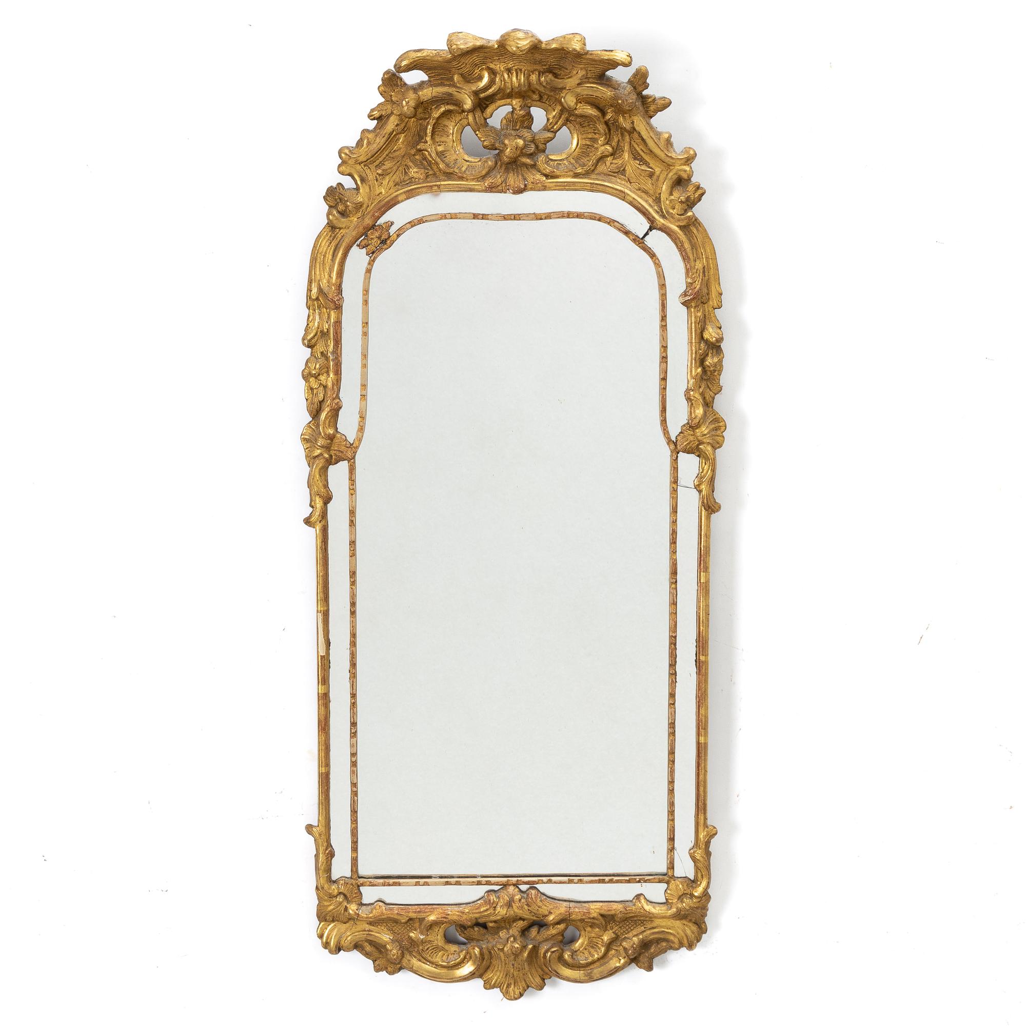 A gilt-gesso rococ-style mirror, 20th century.