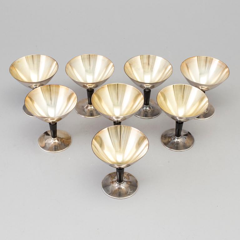 8 pcs of silverplated and bakelite cocktailglasses by Folke Arström.
