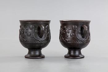 Ivar Johnsson, a pair of Swedish Grace cast iron jardinières, 'Diana' by Näfveqvarn, Sweden 1920's.