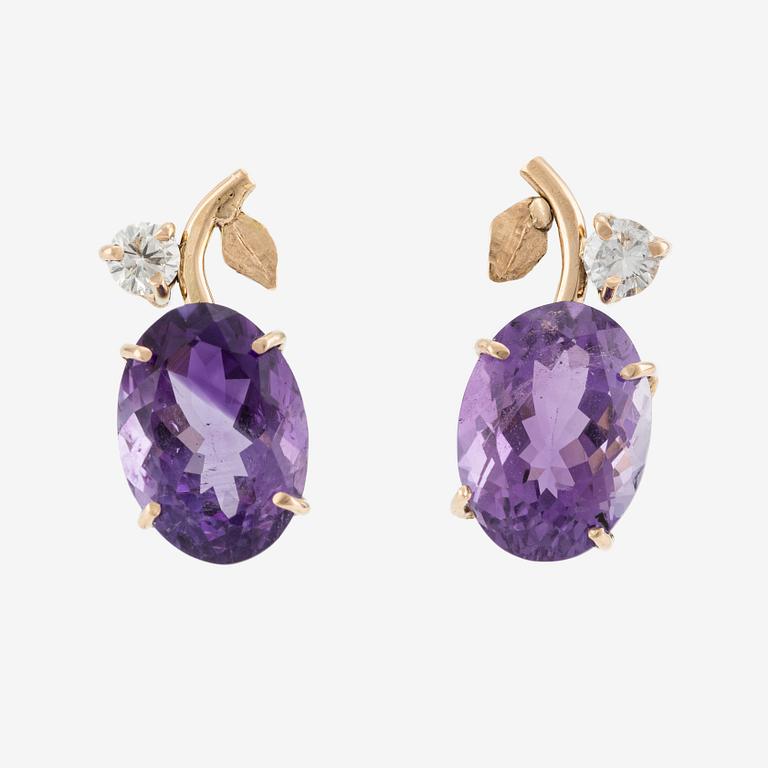 Earrings with amethysts and brilliant-cut diamonds.