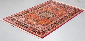 A rug, semi-antique Mashad, ca 224 x 141,5 cm.