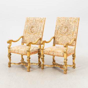 A pair of gilded Baroque style armchairs first half of the 20th century.