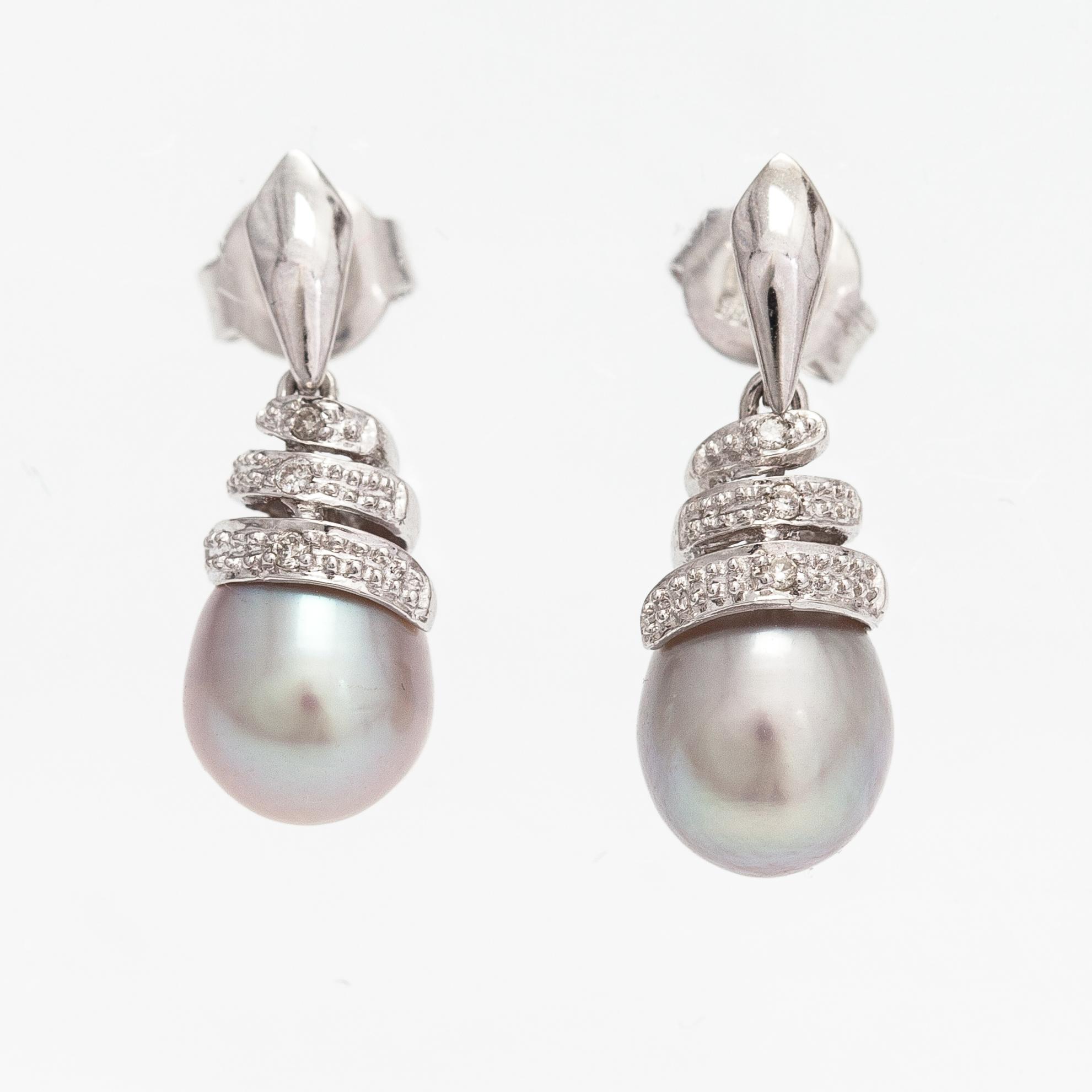 A pair of 14K white gold earrings with cultured pearls and diamonds ca. 0.06 ct in total. Caratia, Helsinki 2001.