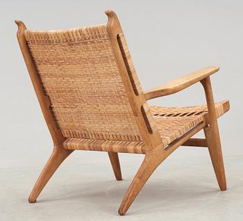 A Hans J Wegner 'CH-27' oak and rattan armchair, Carl Hansen & Son, Denmark 1950's-60's.