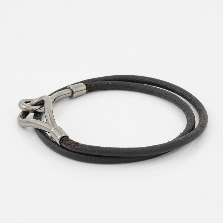Hermès, a 'Jumbo' leather bracelet and a silk scarf.