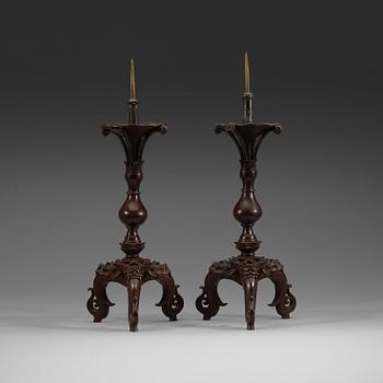 441. A pair of bronze candlesticks, presumably Ming dynasty (1368-1644).