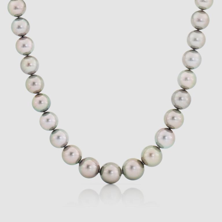 A cultured Tahiti pearl, 12-14.7 mm, and diamond necklace.