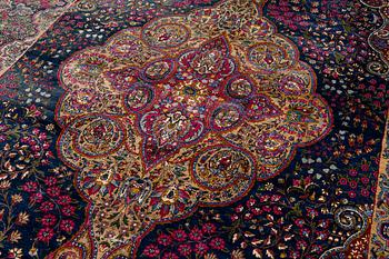 A semi-antique Kirman carpet, south Persia, c. 440 x 279 cm.