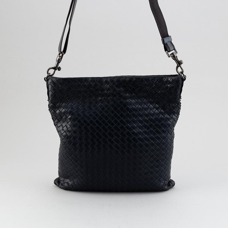 Bottega Veneta, a navy Intrecciato leather messenger bag.