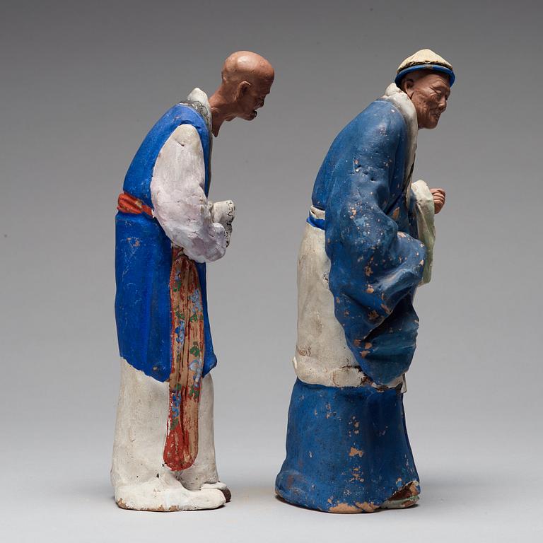 Two clay figures of chinese men, Qing dynasty, 19th Century.