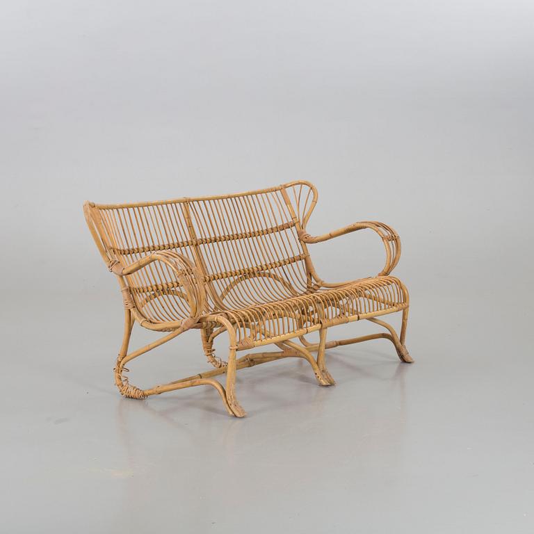 A mid 20th century ratten couch.