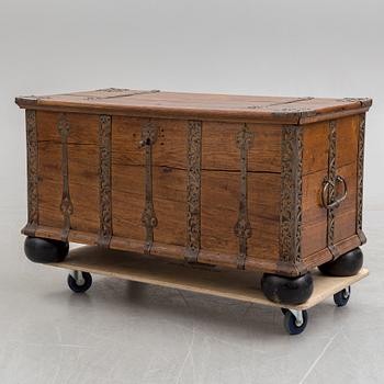 A 18th century baroque oak chest with iron mountings.