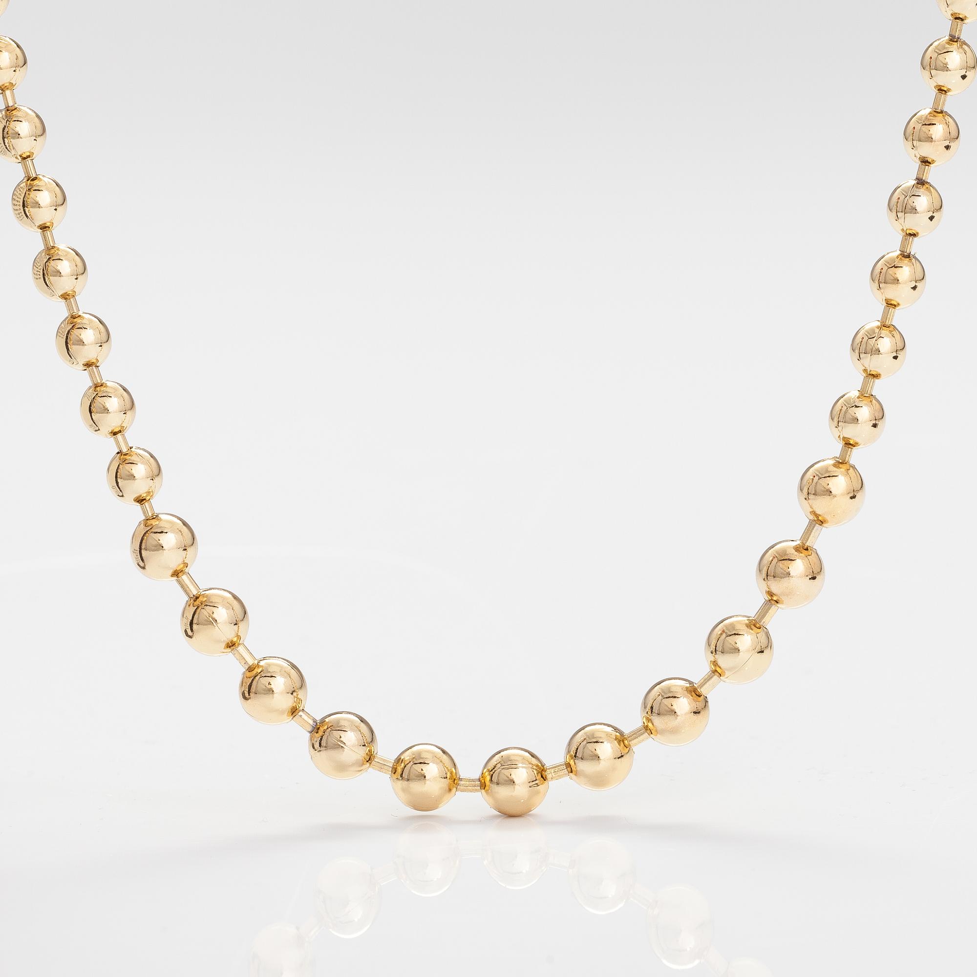 DIOR. A necklace and a pair of earrings in gold coloured metal. Marked Chr. Dior, Germany.