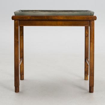 A stoneware tray table signed Bryk.