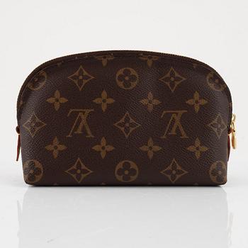 Louis Vuitton, makeup bag and wallet.