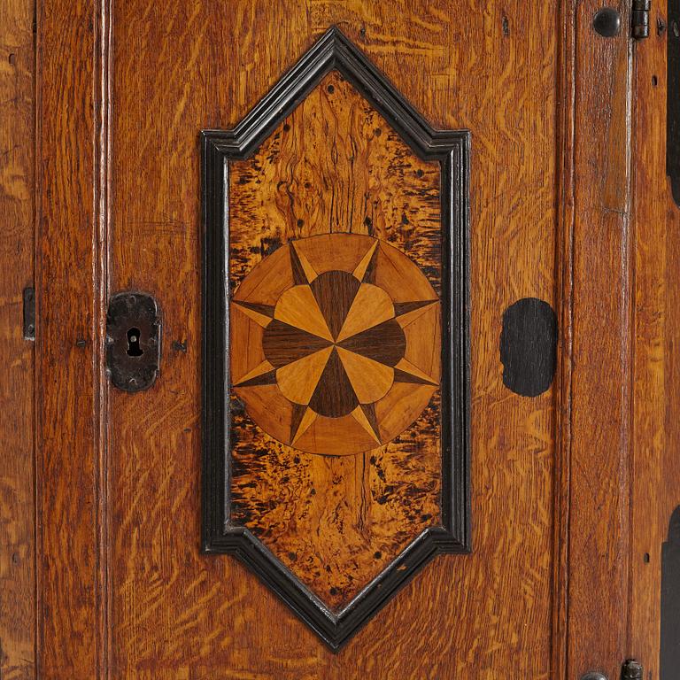 A Baroque corner cabinet, 18th Century.