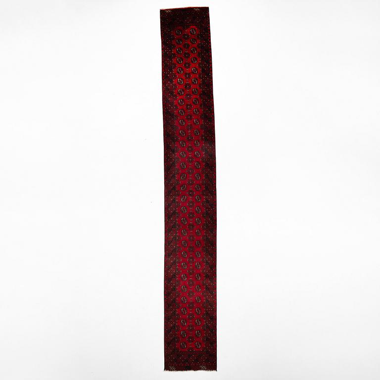 An oriental / Afghan runner, approx. 478 x 81 cm.