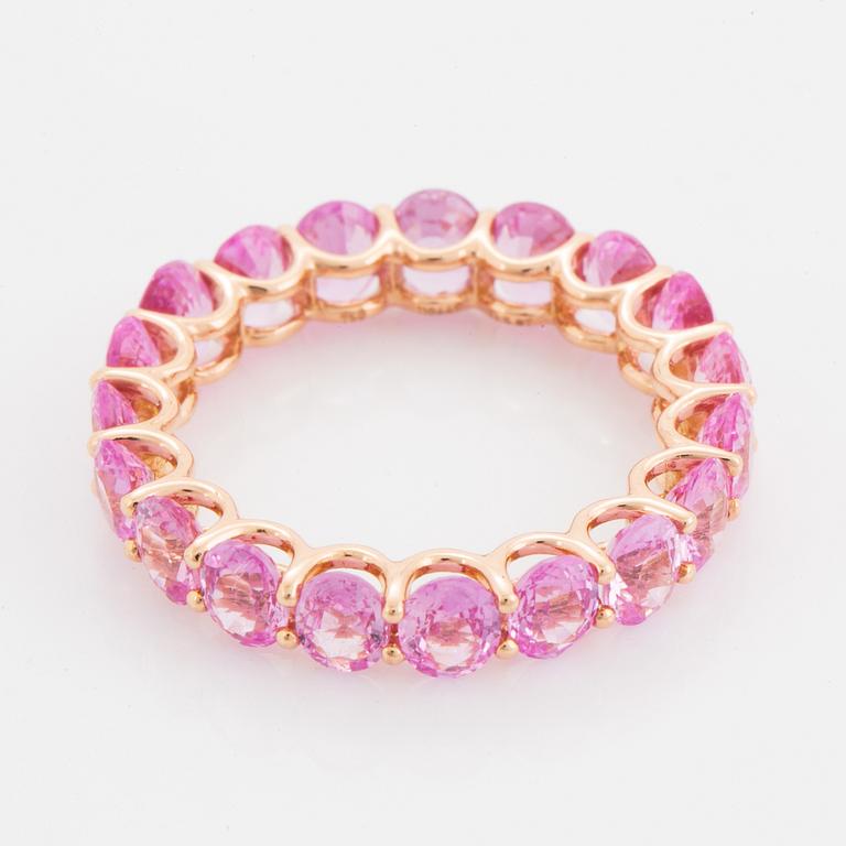 Oval faceted pink sapphire ring.