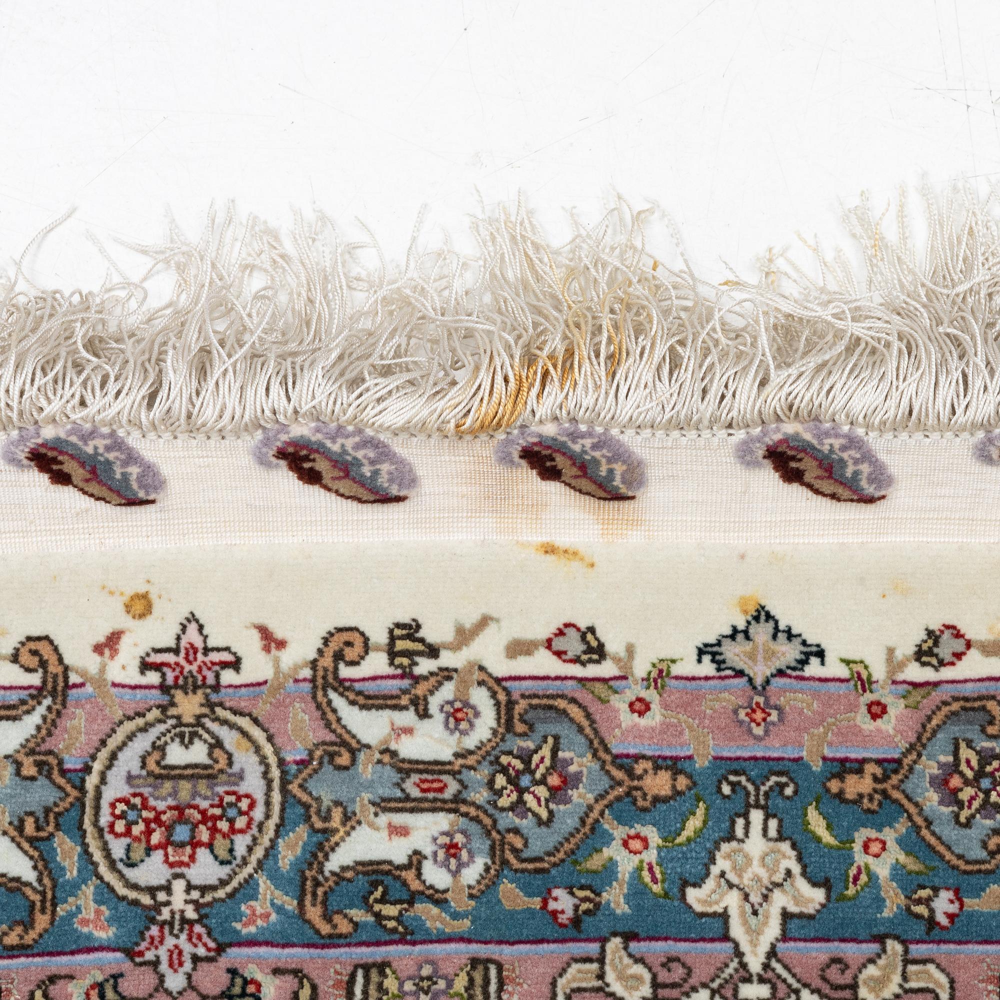 A Tabriz, carpet, 310 x 195 cm. signed.