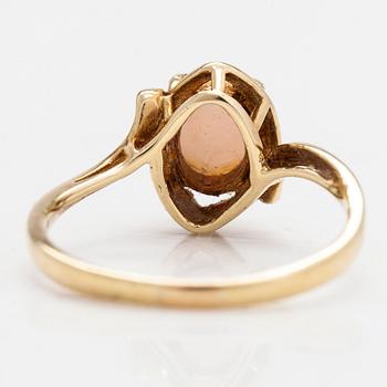 A 14K gold ring with an opal.