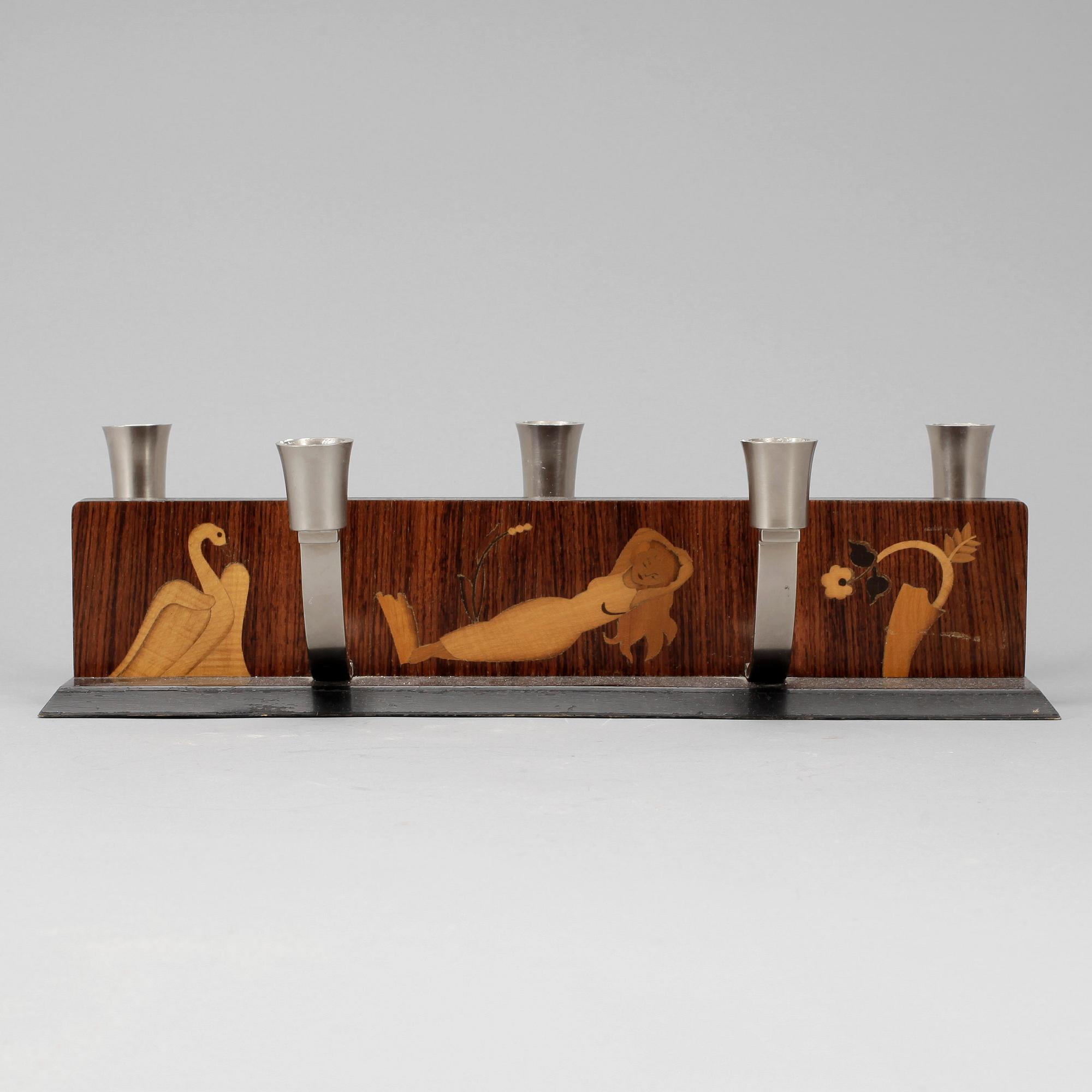 LJUSSTAKE, Mjölby Intarsia, 1900-talets första hälft.