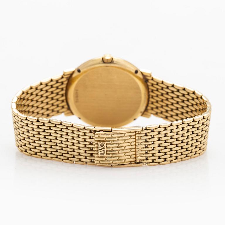 IWC (International Watch Co.), 31 mm, 18K gold, quartz.