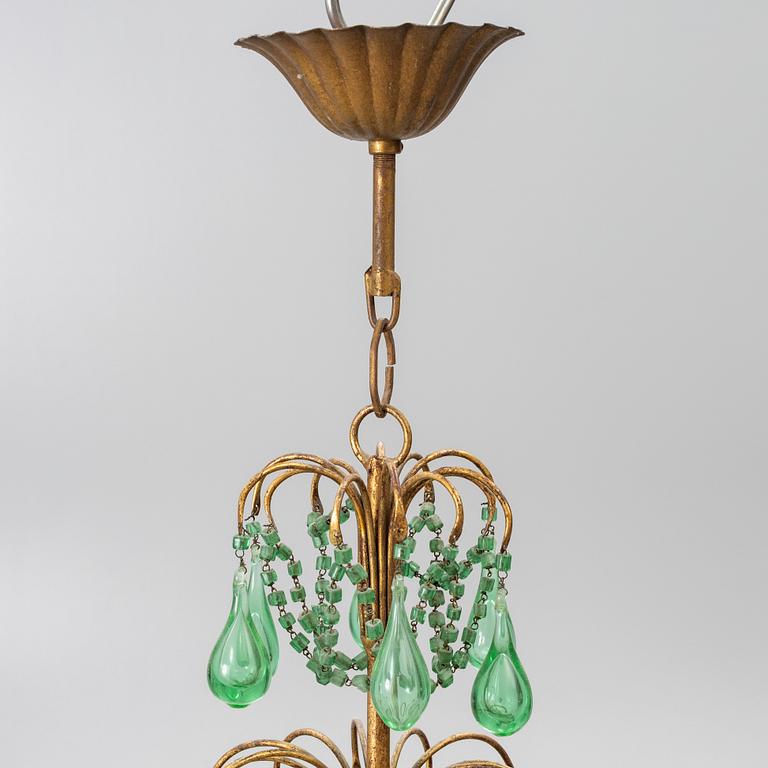 A chandelier, likely from Italy, circa 1950.
