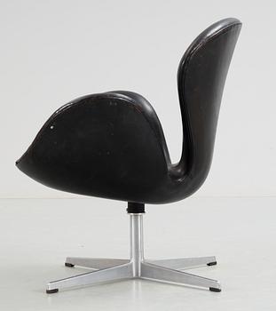 An Arne Jacobsen black leather 'Swan' easy chair, Fritz Hansen, Denmark 1960's.