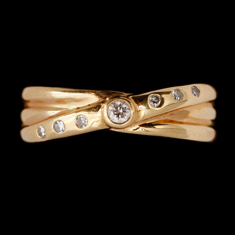 RING, 18 k guld, med 7 små briljanter.