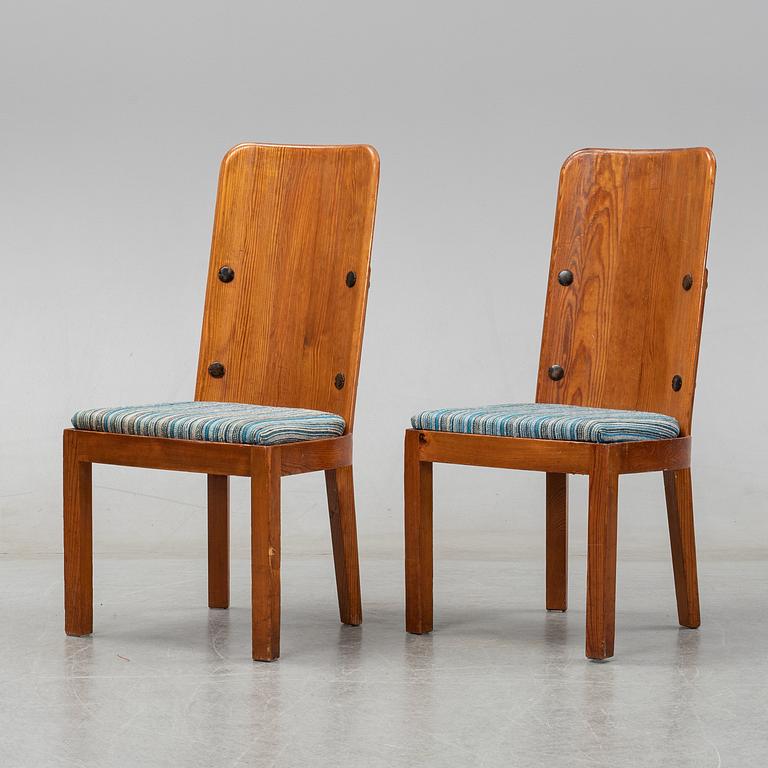 Axel Einar Hjorth, a pair of stained pine "Lovö" chairs, Nordiska Kompaniet, Sweden 1930's.