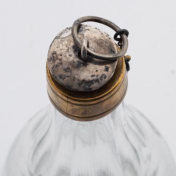 A pair of late gustavian glass and silver vinegar bottles, circa 1800.