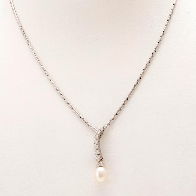 An 18K white gold necklace set with round brilliant-cut diamonds and a cultured pearl.
